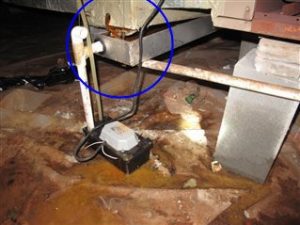 THE AIR HANDLER’S PRIMARY CONDENSATE DRAIN LINE WAS LEAKING