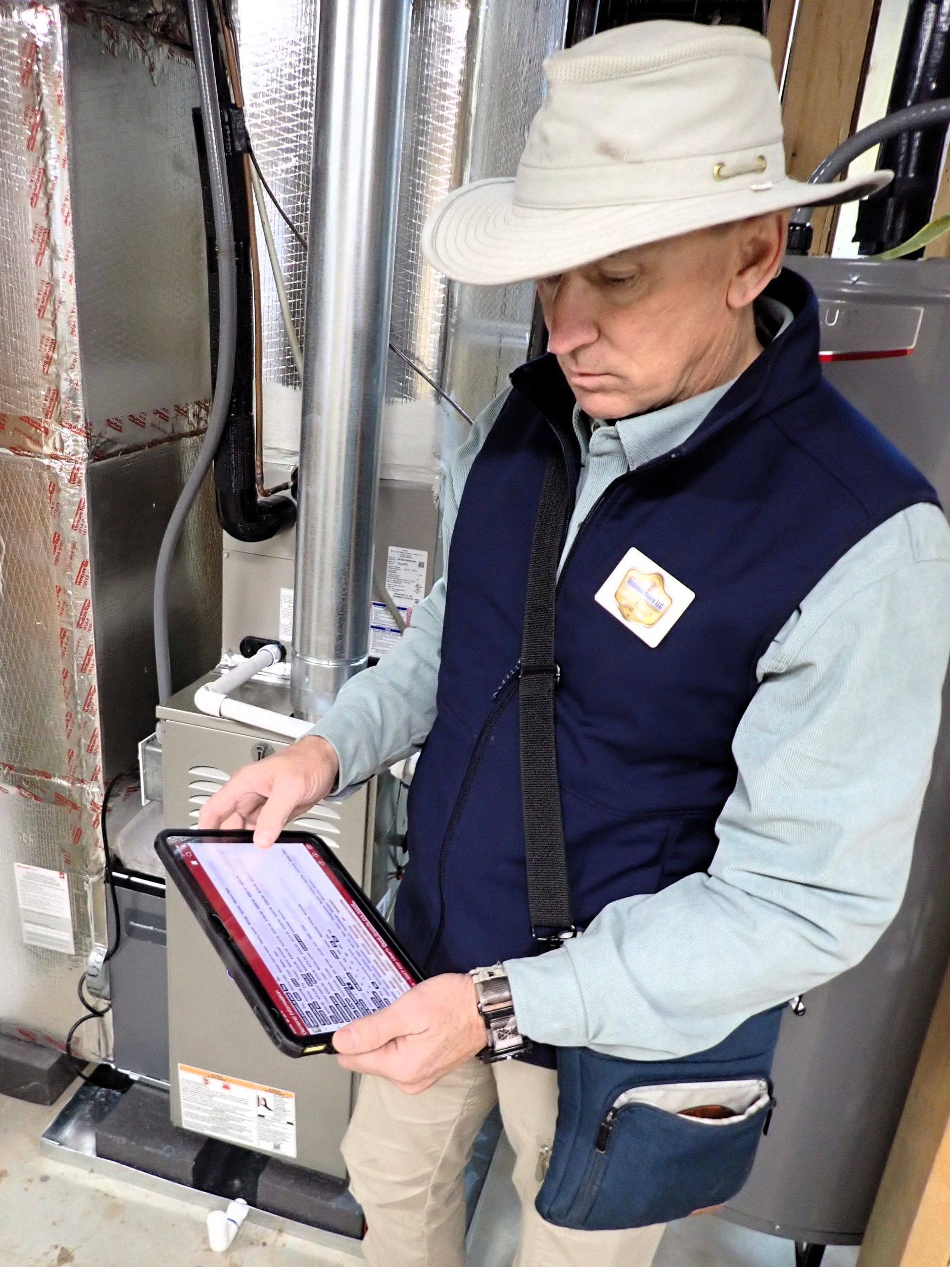 Inspector documenting home inspection findings in Johns Creek