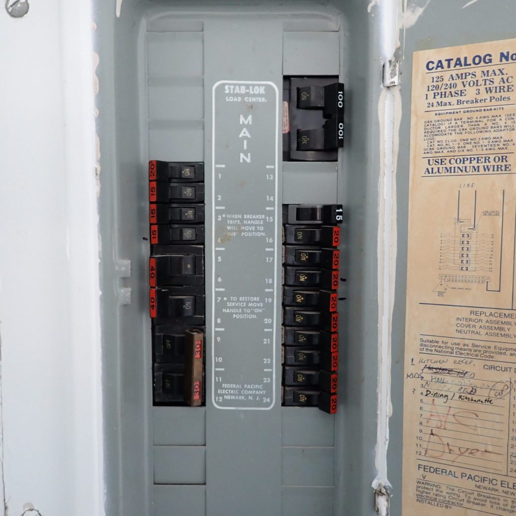 Federal Pacific Stab-Lok panel showing electrical issues in flipped home