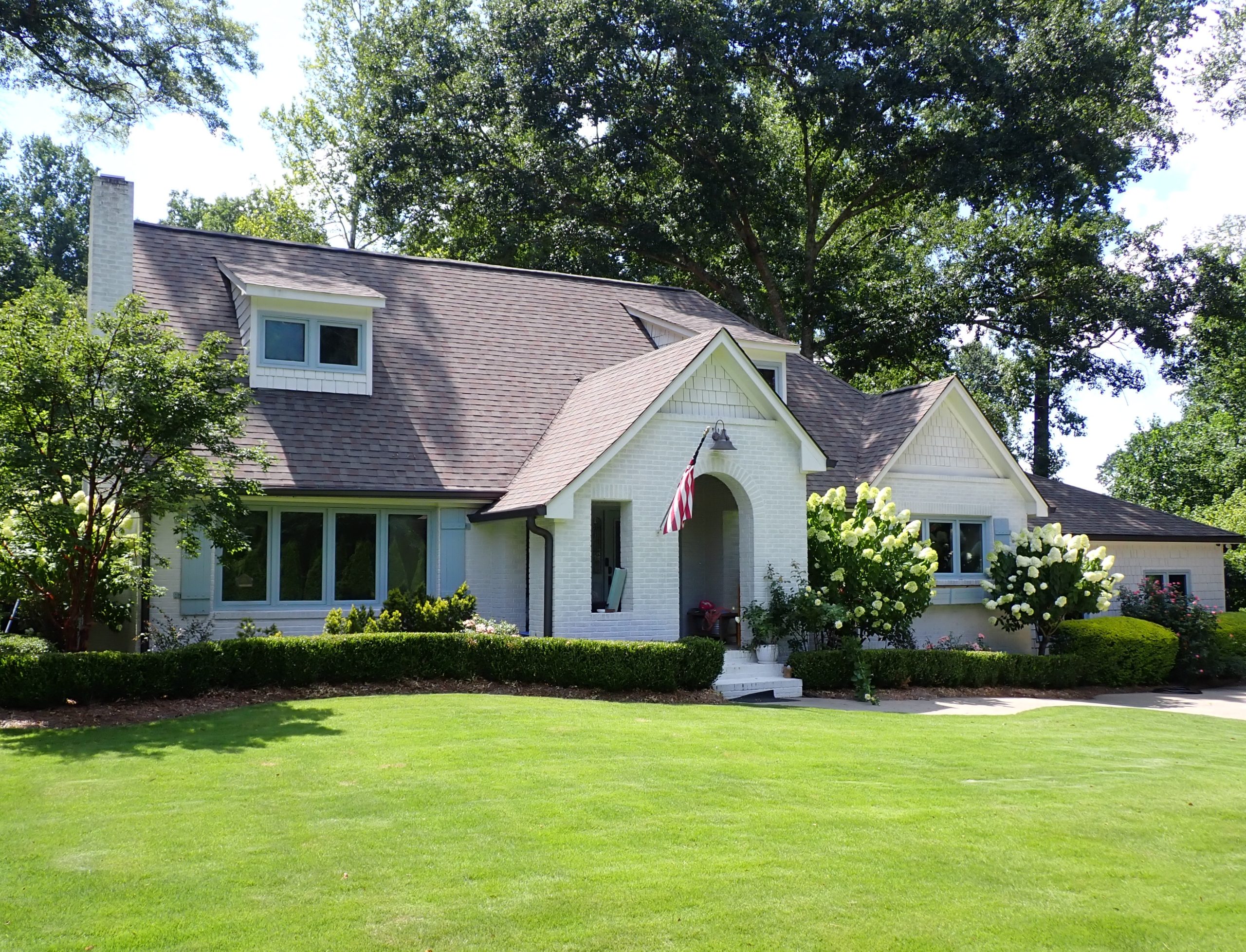 Older home with mature landscaping and established neighborhood setting in North Metro Atlanta