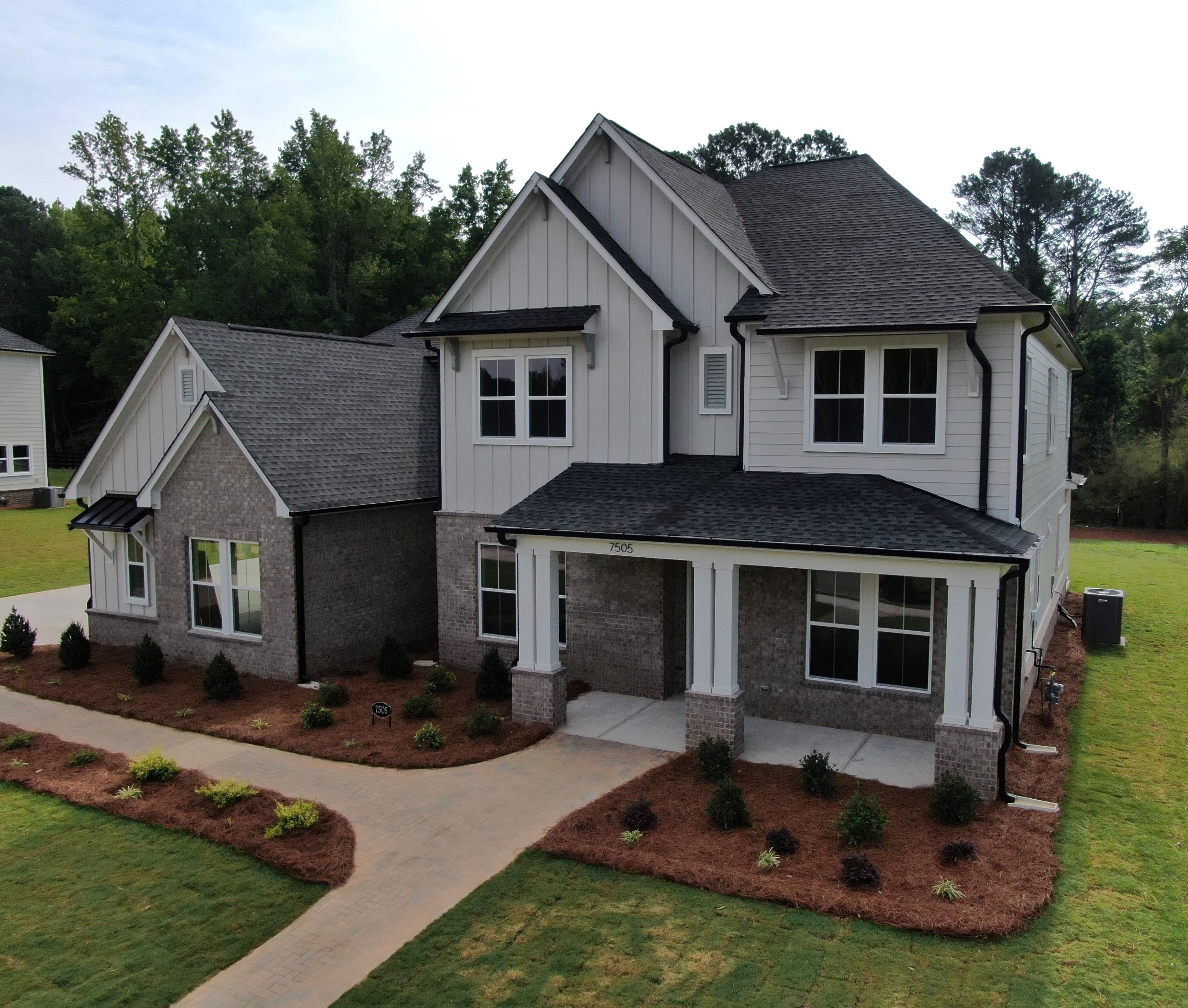 New construction home in North Metro Atlanta with modern exterior materials and fresh landscaping